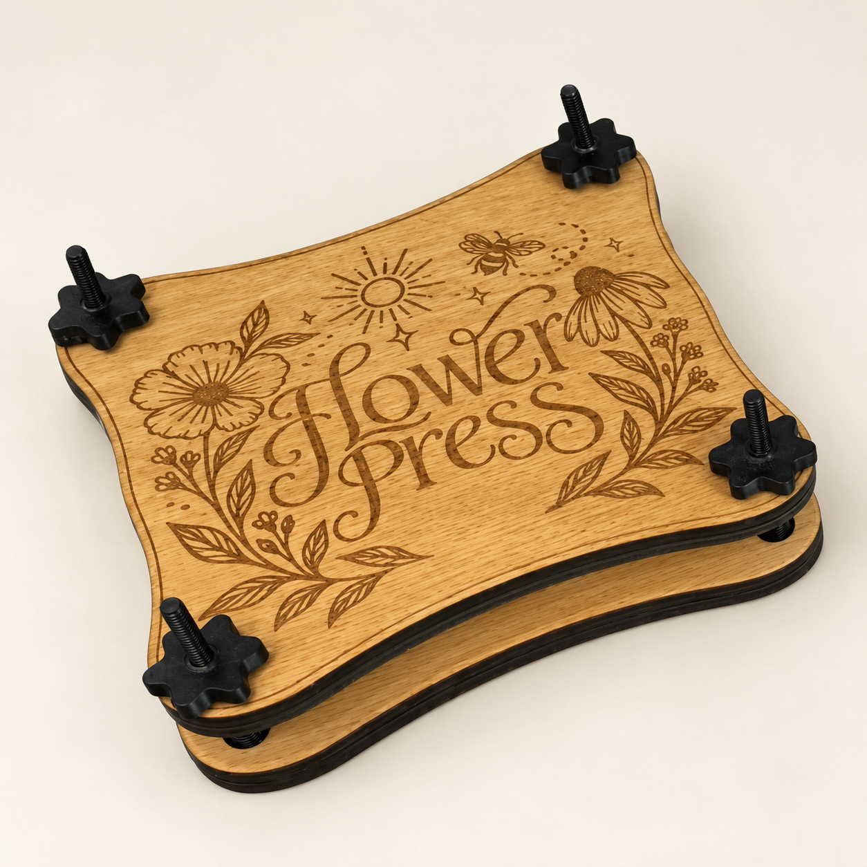 Wooden flower press with floral, bee and sun engraving and four black corner screws