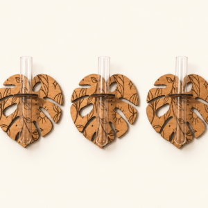 Three wooden monstera propagation stations with clear glass tubes